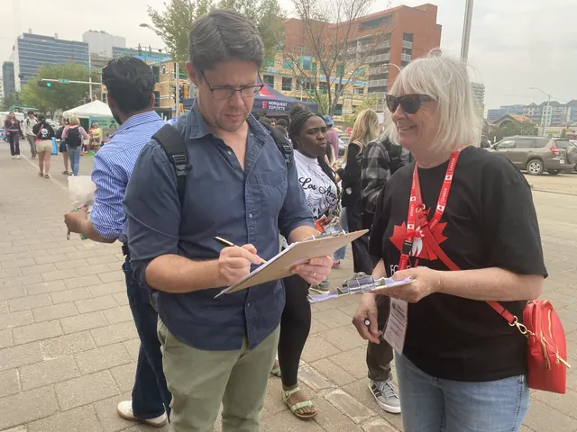Supporters signing the petition at a Forever Canadian booth.